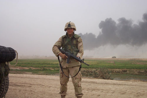 073 - Saddam City, CPL Zimmerman in front of destruction again